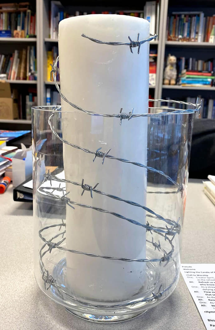 Inspired by the Central Methodist Mission in Johannesburg, which lit a candle encircled in barbed wire during the struggle against apartheid, the Rev. Donna Claycomb Sokol of Mount Vernon Place United Methodist in Washington, D.C., is one of the United Methodist pastors who has helped revive the practice this year. Some 60 United Methodist churches have now joined in, she said. Photo by Claycomb Sokol, courtesy of the Methodist Federation for Social Action.