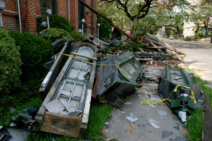 Rubble from windows, parts of the bell tower and the steeple litter the sidewalk in front of Rayne Memorial United Methodist Church in 2005 following Hurricane Katrina. Photo courtesy of the Rev. Callie Winn Crawford.